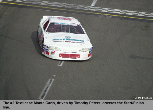 Timothy Peters crosses the finish line in the No. 2 Textilease Monte Carlo