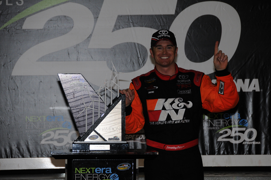 Timothy Peters celebrates his Daytona victory with the NextEra Energy Resources 250 trophy